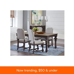 a dining room table and chairs with the words now trending $ 500 & under