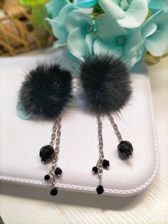 Long stud earrings with Black mink Fur. A luxury gift for her. Length - 8.5 cm, width is approximately 4 cm. Attached to the base of the earring are 2 chains each with black beads and crystals. Handmade item, Available for wholesale as well. The fur part can be custom made in any color. Handmade Black Clip-on Earrings For Gift, Handmade Black Dangle Clip-on Earrings, Black Metal Clip-on Earrings As Gift, Black Metal Clip-on Earrings For Gift, Black Hypoallergenic Jewelry For Party, Black Dangle Plug Earrings As Gift, Black Dangle Plug Earrings For Gift, Trendy Black Clip-on Earrings As Gift, Black Hypoallergenic Earrings For Party