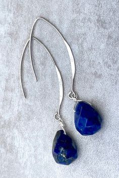 Faceted blue lapis lazuli drops suspended from 925 sterling silver ear wires. LENGTH: 2.1 inches - 5,3 cm - 5 gr. each Drops : 13 x 11 mm MATERIALS: 925 sterling silver Lapis lazuli: Encourages self-awareness, allows self-expression and reveals inner truth, stimulates objectivity, clarity and encourages creativity. Birthstone: September DELIVERY: All jewelry is shipped in a working day with registered mail Tracking available Express shipping is available for UK only Free gift box with every purc Modern Nickel-free Drop Jewelry, Modern Sterling Silver Dangle Jewelry, Modern Long Drop Teardrop Earrings Gift, Nickel-free Long Drop Sterling Silver Earrings, Modern Sterling Silver Teardrop Jewelry, Elegant Sterling Silver Linear Earrings Nickel Free, Elegant Sterling Silver Nickel-free Linear Earrings, Modern Sterling Silver Briolette Jewelry, Modern Handmade Teardrop Jewelry