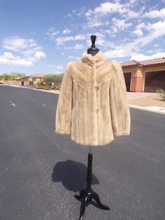 M (10) Grandella FAKE fur, FAUX fur, vegan fur imitation beige mink fur, hip-length coat jacket, E-U-C (#2601) EUC = excellent used condition A soft, beige, hip-length imitation MINK FAKE FUR ... FAUX FUR ... VEGAN FUR jacket coat ... with a pretty front design.  Surprisingly light-weight.  I don't normally sell fake fur items, but this is a very nice quality FAKE FUR.  A classic high collar and nicely crafted "pelts" really add class to this faux fur coat jacket.   The manufacturer has laid the Cream Fur Coat With Faux Fur Lining, Cream Faux Fur Coat With Faux Fur Lining, Cream Fitted Fur Coat With Faux Fur Trim, Fitted Cream Fur Coat With Faux Fur Trim, Fitted Beige Fur Coat With Faux Fur Lining, Fitted Faux Fur Mink-colored Outerwear, Fitted Cream Faux Fur Coat, Vintage Cream Fur Coat With Faux Fur Trim, Mink Colored Fur Coat With Faux Fur Trim