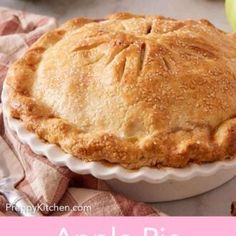 an apple pie sitting on top of a table