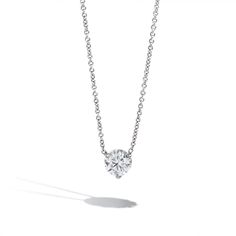 An elegant 1ct round solitaire diamond pendant with G-H color and I1 clarity hangs on a beautiful 18K white gold dainty chain. Round Diamond Necklace, Solitaire Diamond Pendant, Solitaire Necklace, Round Solitaire, Diamond Solitaire Necklace, Dainty Chain, Solitaire Necklaces, Solitaire Diamond, Solitaire Pendant