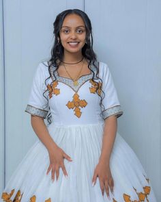 The Habesha dress, also known as Habesha Kemis, is a gorgeous example of Ethiopian traditional dress. This stunning wedding dress is adorned with sparkling beads, showcasing intricate craftsmanship and the rich cultural heritage of Ethiopia. Material Cotton Menen Thread Estimated delivery : 2 weeks to 3 weeks Contact WhatsApp +1(304)-306-2784Email: contact@ethiopian.store Ethiopian Wedding Dress, Ethiopian Wedding, Habesha Dress, Ethiopian Traditional Dress, Habesha Kemis, Traditional Dress, Cultural Heritage, Wedding Dresses Simple, Caicos Islands