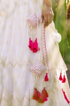 Introducing the stunning Thread Embroidered Blouse Lehenga Set, a must-have for any special occasion! This elegant set features an off-white lehenga crafted from premium quality georgette and net fabrics, giving it a luxurious feel and flowy movement. The intricate thread embroidery on the lehenga adds a touch of sophistication and grace to the ensemble.
The set also includes a matching blouse with exquisite geometric handwork that complements the lehenga perfectly. The blouse is designed with a Festive Traditional White Gown, White Traditional Gown With Zari Work, Traditional White Gown With Zari Work, White Kundan Sharara With Intricate Embroidery, Traditional White Gown With Resham Embroidery, White Unstitched Traditional Gown, White Wedding Gown For Festivals, White Saree Gown For Navratri, White Kundan Sets For Festive Occasions