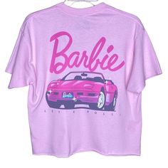 Barbie Graphic T-Shirt Front Barbie Lettering Back Barbie Car Ferrari With “Let’s Roll!” Phrase Crewneck Short Sleeves Raw Cut Hem Vintage Vibes 100% Cotton Color: Pink Size: Medium Bust: 39” Sleeve: 6.5” Length: 21.5” Tags: Spring,Summer,Barbiecore Barbie Lettering, Barbie Graphic, Car Ferrari, Barbie Car, Kids Tee Shirts, California Shirt, Cap Sleeve Tee, White Graphic Tee, Justice Shirts