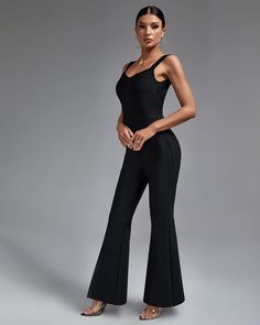 Chic Backless Top: Features an elegant backless design that adds a touch of sophistication and allure. High-Waist Pants: Includes high-waist wide leg pants that create a flattering and stylish silhouette. Figure-Hugging Bandage Fabric: Crafted from high-quality bandage fabric to ensure both comfort and a slimming fit. Sleek Black Color: A classic black hue that exudes timeless elegance and versatility. Perfect for Any Occasion: Ideal for evening parties, casual outings, or formal events where ma Elegant High Waist Wide Leg Elastane Pants, Fitted Pantsuit For Evening, Elegant Stretch Wide Leg Pants For Formal Occasions, Elegant Solid Color Pantsuit For Date Night, Chic Evening Pants In Elastane, Glamorous Fitted Pants For Gala, Elegant High-waisted Elastane Pantsuit, Elegant Stretch Wide Leg Full-length Pants, Elegant Stretch Wide Leg Full Length Pants