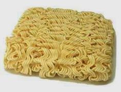 a pile of noodles sitting on top of a white surface