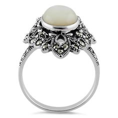 Top of ring height: 27.8mm

Top of ring width: 17.7mm

Band width: 2.8mm

Shank width: 2.8mm



Stone material: mother of pearl

Center stone size: 27.8mm x 17.6mm

Stone shape: oval

Total number of CZ stones: 1

Stone setting: inlay setting



Metal: 925 sterling silver

Finish: high polish White Mother Of Pearl Round Pearl Ring, Classic Mother Of Pearl Round Rings, Classic Mother Of Pearl Rings, Classic White Cabochon Moonstone Ring, Classic White Cabochon Opal Ring, Classic Formal Rings With Mother Of Pearl, Vintage White Oval Cabochon Ring, Classic Mother Of Pearl Ring For Formal Occasions, White Mother Of Pearl Rings