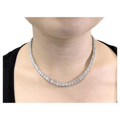 Adorn your wrist with the timeless elegance and shimmering beauty of this exquisite 29.96 Carat Total Round Diamond Tennis Necklace in 18K White Gold. Crafted to perfection, this necklace is a true statement piece that exudes luxury and sophistication. This stunning tennis necklace features a total of 88 brilliant round diamonds, meticulously set in 18K white gold. Each diamond (0.34ct each) boasts excellent cut quality, ensuring maximum brilliance and fire as they catch and reflect the light wi Diamond Tennis Necklace, Tennis Necklace, Modern Necklaces, Tennis Bracelet Diamond, Look Plus, Modern Jewelry, White Gold Diamonds, White Diamond, Round Diamond