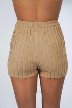 Get ready for summer with our Tiffany Ribbed Shorts! Made with a ribbed design, these pull on shorts are perfect for a comfy and stylish look. Pair them with our matching Tiffany Ribbed Top for a complete outfit. Say goodbye to boring shorts and hello to some serious fashion! Size + Fit Riley is 5'7" and wearing a size Small Content + Care 75% Acrylic 25% Nylon Hand Wash Cold Color Separate Ribbed Loungewear Bottoms With Short Legs, Ribbed Short Leg Loungewear Bottoms, Spring Ribbed Bottoms Short Length, Solid Ribbed Bottoms For Summer, Ribbed Short Bottoms, Stretch Ribbed Short Leg Bottoms, Ribbed Summer Shorts With Short Legs, Ribbed Summer Shorts, Ribbed Stretch Shorts For Loungewear