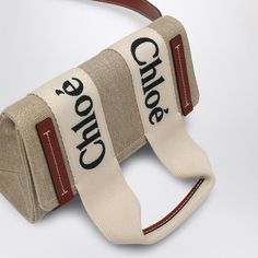 Beige cotton canvas and calfskin leather fanny pack from Chloé featuring an adjustable shoulder strap, a main compartment, an internal flat pocket, and a contrasting Woody ribbon with logo lettering.Gender: WOMENMaterial: 100% CANVAS AND LINEN / LEATHER DETAILColor: BROWNMade in: ESProduct ID: CHC24AS681L17/P_CHLOE-90U*Import tax/duty will be calculated at checkout (If applicable) Ribbon With Logo, Waist Bag Women, Leather Fanny Pack, Easy Organization, Brown Canvas, Beige Brown, Waist Bag, Fanny Pack, Mini Bag