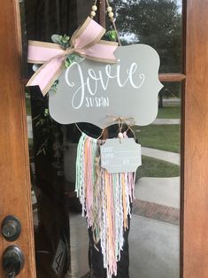 a sign hanging from the front door of a house