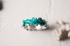 Beautiful ring Wave will bring you back to the sea! This ring is unique! Using hot enamel technique every item receives his own unique texture! https://www.etsy.com/listing/559371911/ - Wide wave ring (10 mm) Details: Width: 5mm Thickness: 1.2 mm Materials: sterling silver 925, hot vitreous enamel These rings in gold: https://www.etsy.com/listing/932462309/ - Gold blue wave https://www.etsy.com/listing/932465221/ - Gold green wave Please provide me size of the ring during the order, thank you! T Green Enamel Ring For Wedding, Ocean-inspired Blue Ring For Gift, Ocean-inspired Blue Ring For Gifts, Ocean-inspired Blue Rings As Gifts, Handmade Enamel Ring For Wedding, Unique Green Enamel Ring For Anniversary, Green Enamel Ring For Anniversary, Unique Green Enamel Anniversary Ring, Unique Enamel Wedding Ring