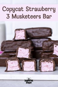 chocolate and pink marshmallows stacked on top of each other with the words copypaat strawberry 3 muskers bar