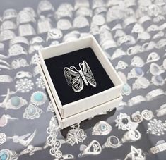 Our ring is a delicate and elegant jewel that combines the beauty of 925 sterling silver with the symbolism of the butterfly. Silver, known for its shine and durability, represents purity and clarity. The butterfly, on the other hand, is a symbol of transformation and rebirth. When you wear a butterfly-shaped ring you convey a special message. The butterfly symbolizes the process of change and personal development. Her transformation from a caterpillar to a beautiful butterfly represents overcom Silver Butterfly Ring, Process Of Change, Butterfly Ring, Silver Butterfly, Find Beauty, Beautiful Butterflies, Sterling Ring, Rings Statement, Personal Development