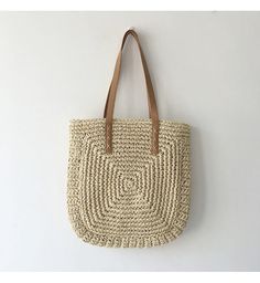 Summer Woven Sand-colored Shoulder Bag, Beachy Sand-colored Beach Bag With Braided Handles, Spring Beach Sand-colored Straw Bag, Sand-colored Straw Bag For Summer Beach, Square Beige Shoulder Bag For Vacation, Beige Square Shoulder Bag For Vacation, Eco-friendly Lightweight Crochet Bag For Spring, Spring Travel Beach Bag Made Of Rattan, Beige Square Bag For Vacation