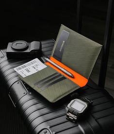 The perfect companion for modern jetsetters who seek style and functionality. With its elegant and compact vertical layout, this wallet offers a sophisticated yet practical design that is perfect for carrying all your essential travel documents. Crafted from high-quality performance fabrics, this passport wallet is built to withstand the wear and tear of even the most rugged of journeys, ensuring that your passport and other documents stay safe and secure. Functional Trifold Wallet For Travel, Functional Rectangular Trifold Wallet For Travel, Functional Rectangular Trifold Travel Wallet, Luxury Rfid Blocking Wallets For Travel, Functional Leather Trifold Wallet For Travel, Trifold Wallet With Rfid Blocking For Travel, Travel Bifold Wallet With Rfid Blocking, Modern Rfid Blocking Travel Accessories, Versatile Trifold Wallet For Travel