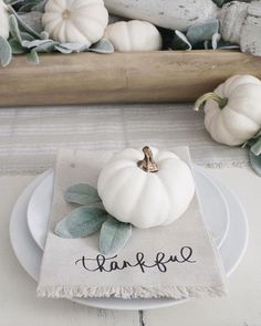 a white pumpkin sitting on top of a plate