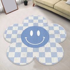 a blue and white rug with a smiley face on it