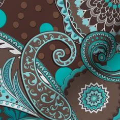 an image of a blue and brown wallpaper with paisley designs on it's side