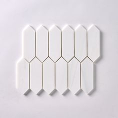 six white hexagonal tiles arranged on top of each other