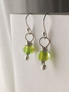 Peridot lime green petite artisan lampwork beads, carefully wrapped by moi with sterling silver wire.   No two beads or earrings are exactly the same which adds to their charm. Dainty and easy to wear, I've already tested my pair of these lovelies on the dance floor (salsa classes and social dancing) and they were perfect. Beautifully detailed artisan lampwork beads, made using German art glass by Amy Hall. I hand crafted the pins for these earrings using sterling silver beads and wire.  Each ea Green Pearl Earrings, Social Dancing, Salsa Classes, Pink Drop Earrings, Petite Earrings, Lampwork Earring, German Art, Green Jewelry, Gold Filled Earrings