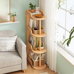 a living room with a couch, chair and bookshelf next to a window