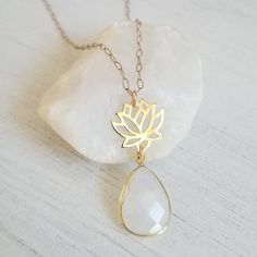 Gold Lotus Flower with Moonstone Teardrop Pendant Necklace Elegant Jewelry With Moon Charm For Meditation, White Spiritual Flower Pendant Jewelry, Spiritual White Flower Pendant Jewelry, Spiritual White Birthstone Necklaces, Spiritual White Necklace As Gift For Her, Teardrop Gemstone Pendant For Meditation, Spiritual Moonstone Jewelry For Meditation, Spiritual Teardrop Moon Charm Jewelry, Elegant Teardrop Pendant Jewelry For Meditation