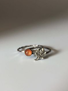 Welcome to Miss November Studio! I specialize in dainty feminine personalized jewelry for the discerning jewelry lover. This listing is for a single sterling silver maple leaf stacking ring. All other rings are sold separately. Make a stack! Add a custom stamped band and two gemstone stacking rings with stones like black onyx and garnet. https://www.etsy.com/listing/150142799/set-of-3-rings-one-personalized-message ********** Stacking rings are excellent accessories, not to mention fun to collect and wear. One ring worn alone is dainty, two is quaint, but a loaded stack is a statement! I love to mix and match my stacking rings. I mix metals and make different stacker themes. Occasionally I wear a single stacking ring with a mantra or a word of encouragement to meditate on. ********** Pleas Minimalist Sterling Silver Leaf Jewelry, Minimalist Leaf-shaped Sterling Silver Jewelry, Nature-inspired Adjustable Stackable Rings As Gift, Everyday Sterling Silver Leaf Jewelry, Dainty Amber Sterling Silver Jewelry, Nickel-free Adjustable Leaf-shaped Jewelry, Nickel-free Adjustable Leaf Jewelry, Adjustable Nickel-free Leaf-shaped Jewelry, Nature-inspired Leaf Jewelry For Everyday