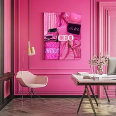 a desk with a laptop on it in front of a pink wall that has the word's name written on it