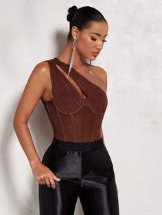 Looking for the perfect party wear that's sure to turn heads? Then get yourself the comfort of One Shoulder Cut Out Sleeveless Bodysuit. This stunning piece features a bold and stylish one-shoulder neckline, with a unique and asymmetrical cut-out design that sets it apart from the crowd. The contrast mesh detailing adds a touch of sophistication to the bodysuit making it the ultimate statement piece for any special occasion. Specifications: Style: Party wear Pattern Type: Plain Neckline: One Sho Chic Sleeveless Party Bodysuit, Chic Sleeveless Bodysuit For Party Season, Fitted Sleeveless Bodysuit For Party Season, Stretch One Shoulder Top For Party, Glamorous Fitted One Shoulder Top For Night Out, Fitted Sleeveless Party Bodysuit, Fitted Sleeveless Bodysuit For Party, Fitted One-shoulder Bodysuit For Evening, Chic One-shoulder Crop Top For Party