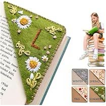 the book is decorated with flowers and grass