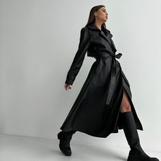 Faux leather trench coat .The inner part is high-quality suede. Black color with black satin lining. Fastening with beautiful decorative buttons and belt that ties at the waist. The trench coat is long a little wide at the bottom. The sleeve is decorated belt with buttons that allows you to tighten the sleeve as you wish. Has pockets Composition 100% polyester Sizes: XS-S, M-L XS-S Chest up to 90 Waist up to 80 Hips free M-L Chest up to 100 Waist up to 86 Hips free Sleeve length from neckline 76 Trenchcoat Dress, Faux Leather Trench Coat, Trench Coat Dress, Black Leather Coat, Satin Noir, Leather Trench, Trench Coat Black, Leather Trench Coat, Decorative Buttons