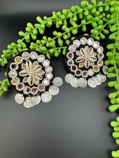 This is a beautiful Quirky beaded Earrings in black color  with mirror, beads and shells work, very very beautiful boho style and looks good on any attire. This is very beautiful to look at and a perfect one for regular wear and also parties.  Color : black length : 3.5 inch width : 2.75 inch Each earring Weight : 16.8 grams Material : Beads, Fabric, metal, shells(cowrie/cowri) Beautiful High Quality, premium jewelry. Free US standard shipping. Hand crafted in India with the finest design, this Bohemian Dangle Clip-on Earrings For Party, Bohemian Drop Clip-on Earrings For Wedding, Bohemian Beaded Flower Earrings For Wedding, Bohemian Bridal Earrings For Wedding, Beaded Bohemian Chandelier Earrings For Party, Bohemian Beaded Chandelier Earrings For Party, Embellished Bohemian Jewelry, Handmade Bohemian Bridal Earrings For Party, Bohemian Clip-on Earrings For Party