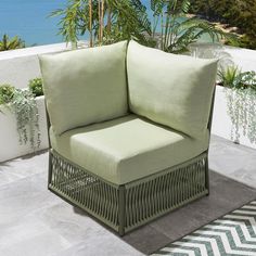 a green chair sitting on top of a patio