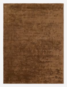 a brown area rug with an uneven design