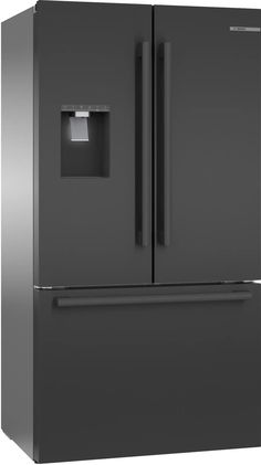 a large gray refrigerator freezer sitting next to a white wall and light on the door