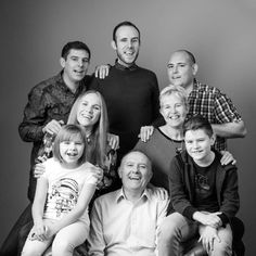 a family poses for a black and white photo