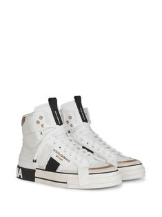 White/black/gold calf leather/leather high-top lace-up sneakers from DOLCE & GABBANA featuring round toe, front lace-up fastening, perforated detailing, gold-tone hardware, logo patch at the tongue, branded insole, padded ankle, logo-embellished side panels, logo print to the rear and flat rubber sole. Hardware Logo, Leather High Tops, Lace Tops, Sneakers White, Golden Goose Sneaker, Logo Print, High Top, Patch Logo, Lace Front