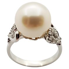 South Sea Pearl with Diamond 0.16 carat Ring set in 18 Karat White Gold Settings Width: 1.8 cm Length: 1.0 cm Ring Size: 52 Total Weight: 5.14 grams South Sea Pearl: 10.09 mm "We first opened doors in 1980 when it was then situated in the vicinity of the Victory Monument; a small and modest storefront with a couple of counters. From its humble beginnings to where it stands today, our company has proven its abilities as a jeweler. Since the beginning, we have been supplying fine quality pieces to dealers, wholesalers and customers worldwide. From then till now, our business still interrelates its name with quality products and excellent service, where commitment and sincerity toward customers will always be its motto." Diamond Ring Set, Pearl And Diamond Ring, Diamond Ring Settings, Sea Pearl, South Seas, South Sea Pearls, Sea Pearls, Pearl Diamond, Solitaire Ring