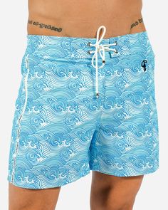 Ready to make waves at the beach or pool? Our NEW 5” Make Waves Swim Shorts are here to make a splash and revolutionize your swimwear game! These men’s swim shorts offer unbeatable style, comfort, and convenience. Featuring zipped pockets, these swim shorts give you a safe and secure place to store your phone, keys, and other small essentials while you're out enjoying the sun and sand. So you can keep your hands free and enjoy your beach activities without any worries. Made from quick-drying, st Blue Swim Trunks, Make Waves, Beach Activities, Enjoying The Sun, Range Of Motion, Beach Club, Swim Trunks, Hands Free, Swim Shorts