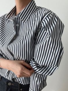 A luxe collared cotton-blend striped shirt with oversized balloon sleeves. Slight stretch from spandex material. Model is wearing MINUSEY ONE SIZE. ✔️ Free worldwide express shipping over $100✔️ Loved by 6,500+ customers✔️ Limited edition collections, maximum style⠀⠀⠀⠀⠀⠀⠀⠀⠀Stay ahead of the trend with can’t-find-anywhere-else staples. Your closet will thank you 💕 * MINUSEY ONE SIZE = EU 34-38, US 2-6* 80% Cotton / 17% Rayon / 3% Spandex* Dry clean* Made in Korea - Model Height: 170cm/5'7" (US2, EU34) Trendy Striped Puff Sleeve Top, Black Collared Top With Striped Cuffs, Black Collared Tops With Striped Cuffs, Black Striped Cuffs Tops For Work, Black Tops With Striped Cuffs For Work, Black Workwear Tops With Striped Cuffs, Casual Black Blouse With Vertical Stripes, Black Casual Blouse With Vertical Stripes, Striped Blouse With Puff Sleeves