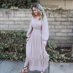 100% Rayon Lining: 100% Polyester Square Neck Lace Detail Full Lining Lace Wrist And Tier Details Invisible Back Zipper Measurements (Approximately): Small: Bust 38”/ Waist 28” Medium: Bust 40”/ Waist 30” Large: Bust 42”/ Waist 32” Modest Flowy Beige Maxi Dress, Flowy Beige Modest Maxi Dress, Beige Flowy Modest Maxi Dress, Modest Beige Maxi Dress, Chic Taupe Maxi Dress For Spring, Modest Beige Maxi Dress For Fall, Prarie Dress, Lilly Pulitzer Maxi Dress, Light Grey Sweater