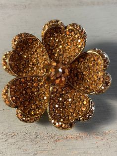 "The rare, beautiful 1950s Hollycraft gold pave set rhinestone flower brooch.  2\" round.  This brooch is in pre-loved condition with 3 missing stones. Very hard to find, but they are on the outside edge. I have a difficult time trying to locate them even knowing they are there.  Priced accordingly" Gold Flower Brooch For Party, Gold Flower Brooches For Party, Vintage Gold Brooch With Bling, Gold Flower-shaped Brooch With Rhinestones, Gold Flower-shaped Brooches With Rhinestones, Gold Flower-shaped Rhinestone Brooches, Gold Flower Brooches With Rhinestones, Butterfly Scarf, Trifari Jewelry