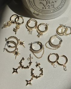 When the hopeless romantic gets a rock n roll makeover. These chunky hoops are the ultimate mash-up: rows of sparkly cz stones take center stage while the dangling chain give them an edge. 14k gold plated brass & palladium Steel posts Hoop measures approx 17mm Accented with cubic zirconia gems for added sparkle Coated for long-wearing protection Trendy Cubic Zirconia Hoop Jewelry, Trendy Round Jewelry With Sparkling Stones, Trendy Jewelry With Dangling Charms, Party Dangle Huggie Earrings, Trendy Small Hoop Cubic Zirconia Jewelry, Gold Dangle Huggie Earrings For Party, Party Huggie Single Earring, Trendy Hoop Jewelry For Jewelry Making, Dazzling Dangle Hoop Earrings