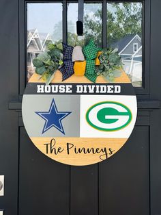 the front door is decorated with green bay packers and house divided decorations, including a football helmet