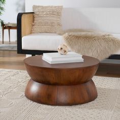 a living room with a couch, chair and coffee table in front of a white sofa