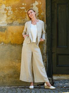 "MADE TO ORDER - Basic long, flared linen pants, fluid and breezy, ideal for hot summer days. Featuring a minimalist design, they can be easily matched with any top of your choice: boxy, cropped, fitted or even tunics. Finished in a topstitched elastic waistband to fit and flatten all body shapes. Shown here in Oatmeal 200 gsm medium weight linen. SIZING To choose the right size, check out our body measurements chart displayed in the product listing photos. If you need specific sizing recommenda Chic Flax Trousers, Spring Linen Wide Leg Ankle-length Pants, Spring Linen Wide Leg Pants, Summer Workwear Pants In Flax Color, Summer Workwear Pants In Flax, Spring Ankle-length Linen Wide Leg Pants, Spring Flax Pants With Pockets, Linen Wide-leg Pants For Fall, Wide-leg Linen Bottoms For Fall