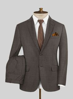 Personify pure sophistication when you wear this Napolean Sharkskin Brown Wool Suit. Crafted from wool blend, this suit is stylishly designed from the super fine wool fabric with classic sharkskin finish. Wear it with its matching waistcoat, a white shirt, a dark gray tie and black shoes to seal the ensemble. 
 
 Look Includes  Napolean Sharkskin Brown Wool Fabric  Two Button Jacket Style  Notch Lapel  Faux Horn Brown Buttons  Single Vent  Three Cuff Buttons  Two Welted Back Pockets on Trousers Semi-formal Custom Fit Single Button Suits, Semi-formal Custom Fit Single Breasted Suits, Elegant Slim Fit Brown Blazer, Semi-formal Custom Fit Notch Lapel Suits, Semi-formal Custom Fit Suits With Notch Lapel, Custom Fit Notch Lapel Suit For Semi-formal Occasions, Semi-formal Notch Lapel Custom Fit Suits, Elegant Custom Fit Brown Blazer, Brown Three-piece Suit For Semi-formal Events