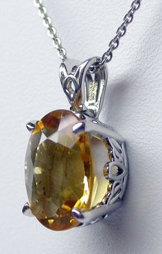 YELLOW CITRINE NECKLACE STERLING SILVER/ GENUINE YELLOW CITRINE PENDANT/ NOVEMBER BIRTHSTONE NECKLACE/ GENUINE GEMSTONE PENDANT/ STERLING SILVER CITRINE NECKLACE Genuine oval Citrine 5.78 ct medium yellow 12 mm by 10 mm sterling silver handmade and set by me. The basket has handmade scroll work on the sides. The gemstone is vibrant yellow citrine set in a hand made 4 prong sterling silver setting . The chain is available in 16 or 18 inches. please specify the length when ordering. free shippingw Oval Citrine Gemstone Necklaces, Oval Citrine Gemstone Necklace, Yellow Oval Citrine Jewelry, Oval Citrine Amber Necklace, Oval Amber Citrine Necklace, Oval Yellow Jewelry As Gift, Oval Yellow Citrine Necklace, Yellow Oval Citrine Necklace, Yellow Gemstone Oval Pendant Necklace